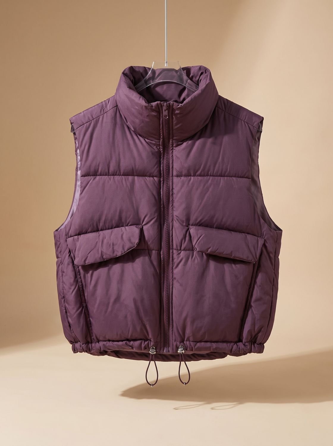 Dames korte gewatteerde bodywarmer met trekkoord in de zoom