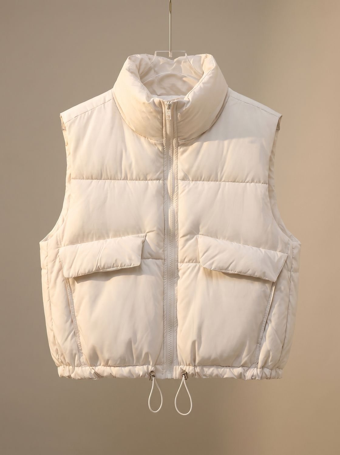Dames korte gewatteerde bodywarmer met trekkoord in de zoom