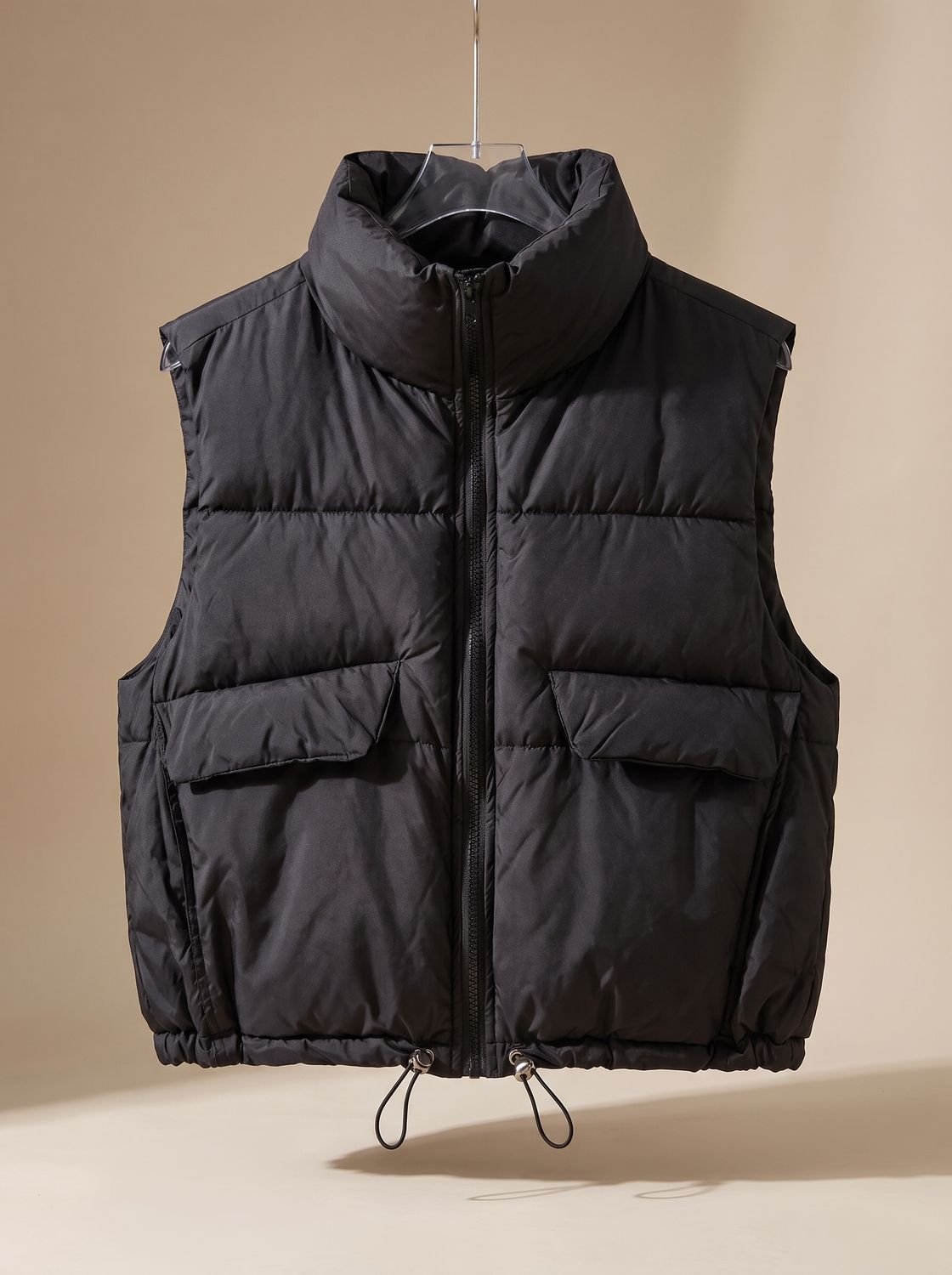Dames korte gewatteerde bodywarmer met trekkoord in de zoom