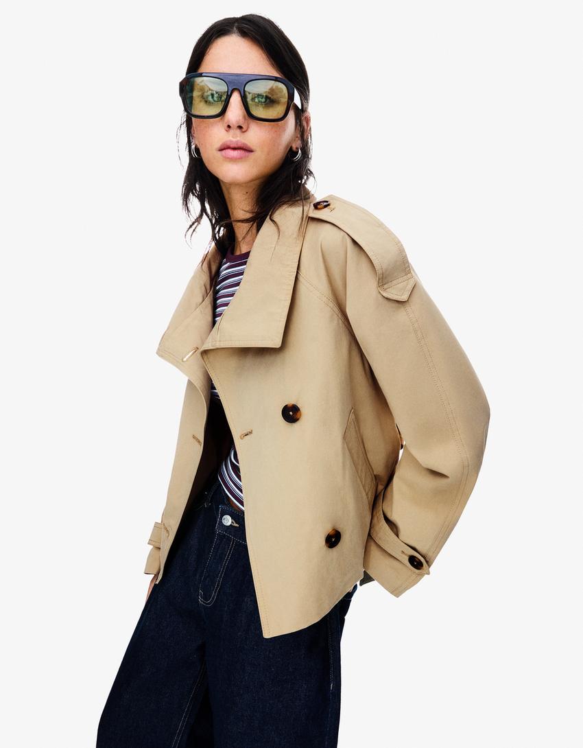 Dames korte trenchcoat met dubbele knoopsluiting
