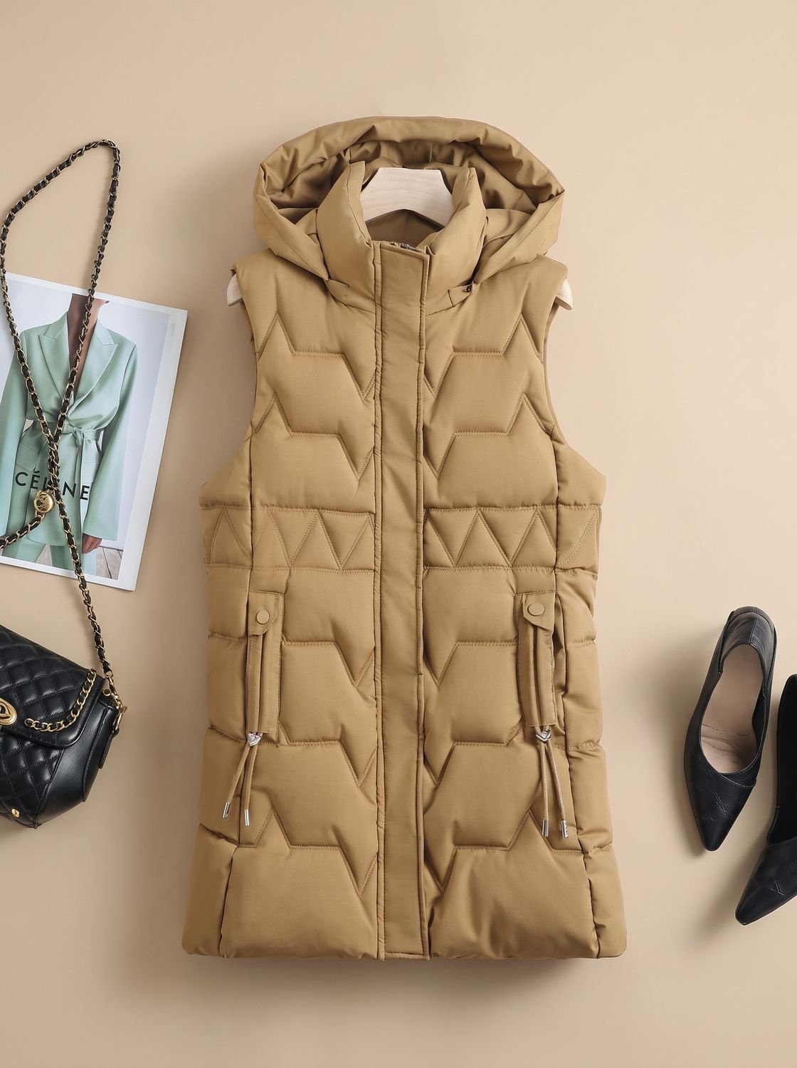Dames lange gewatteerde bodywarmer met capuchon