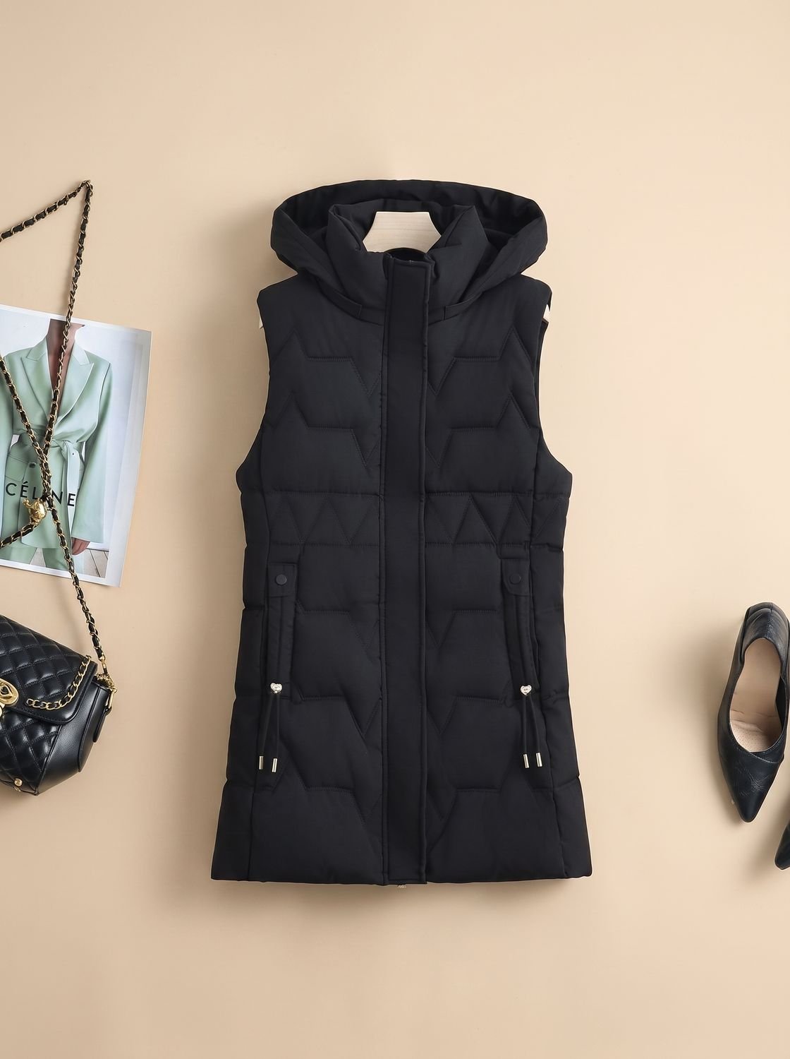Dames lange gewatteerde bodywarmer met capuchon