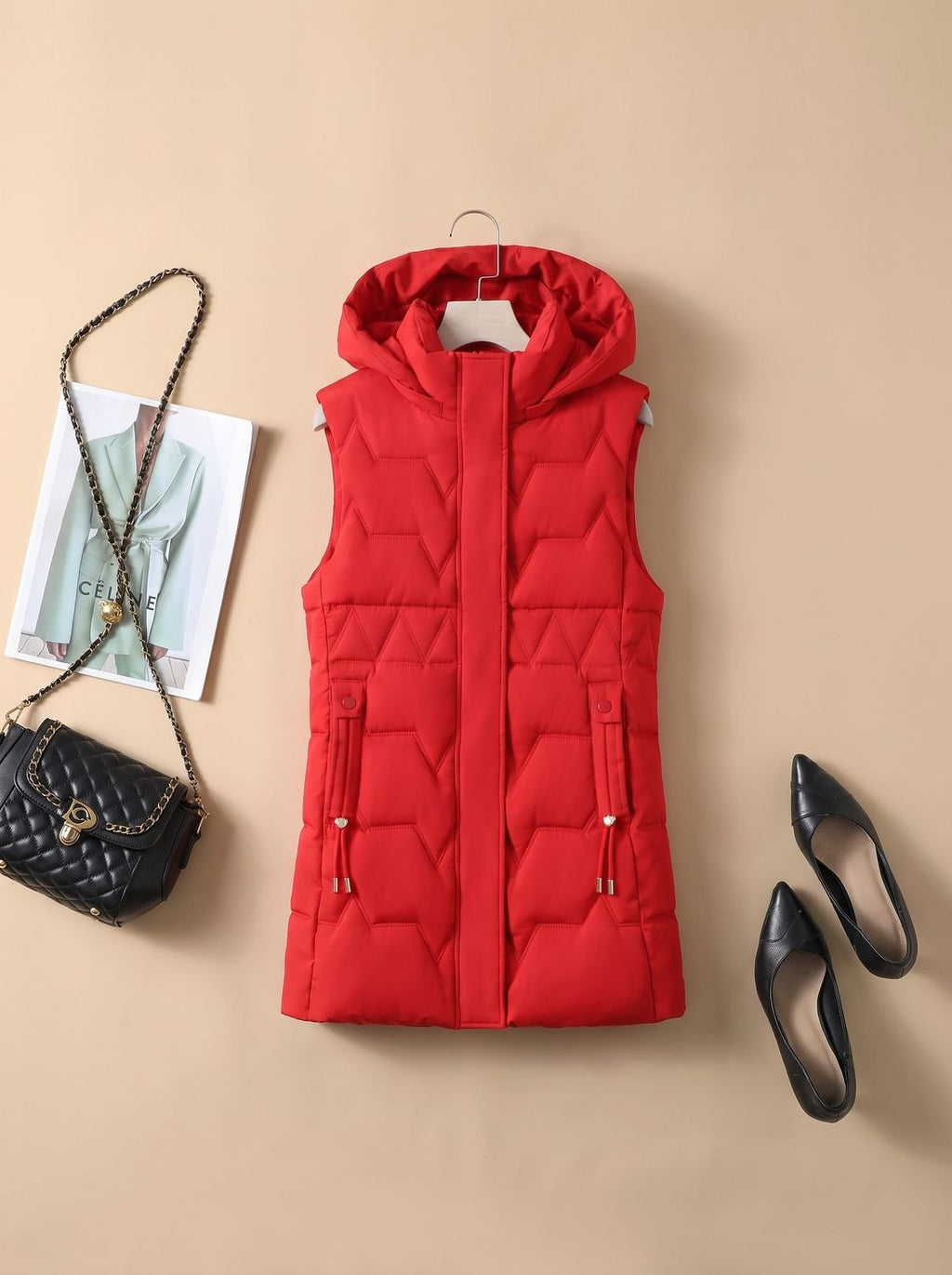 Dames lange gewatteerde bodywarmer met capuchon