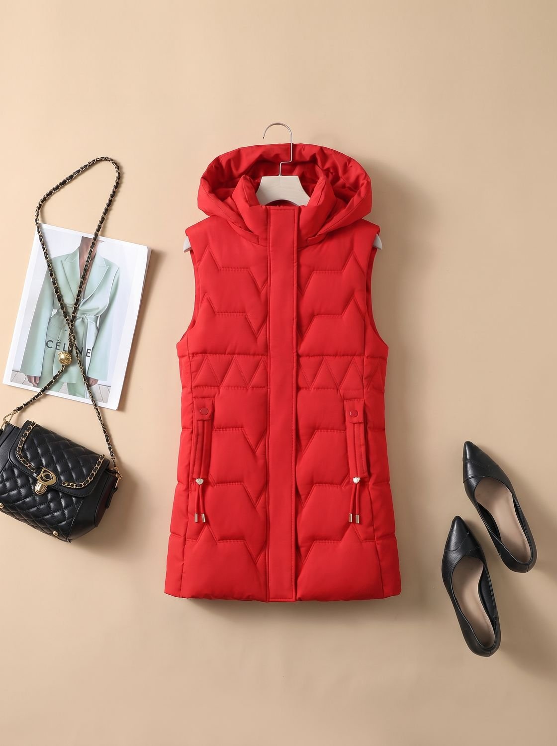 Dames lange gewatteerde bodywarmer met capuchon