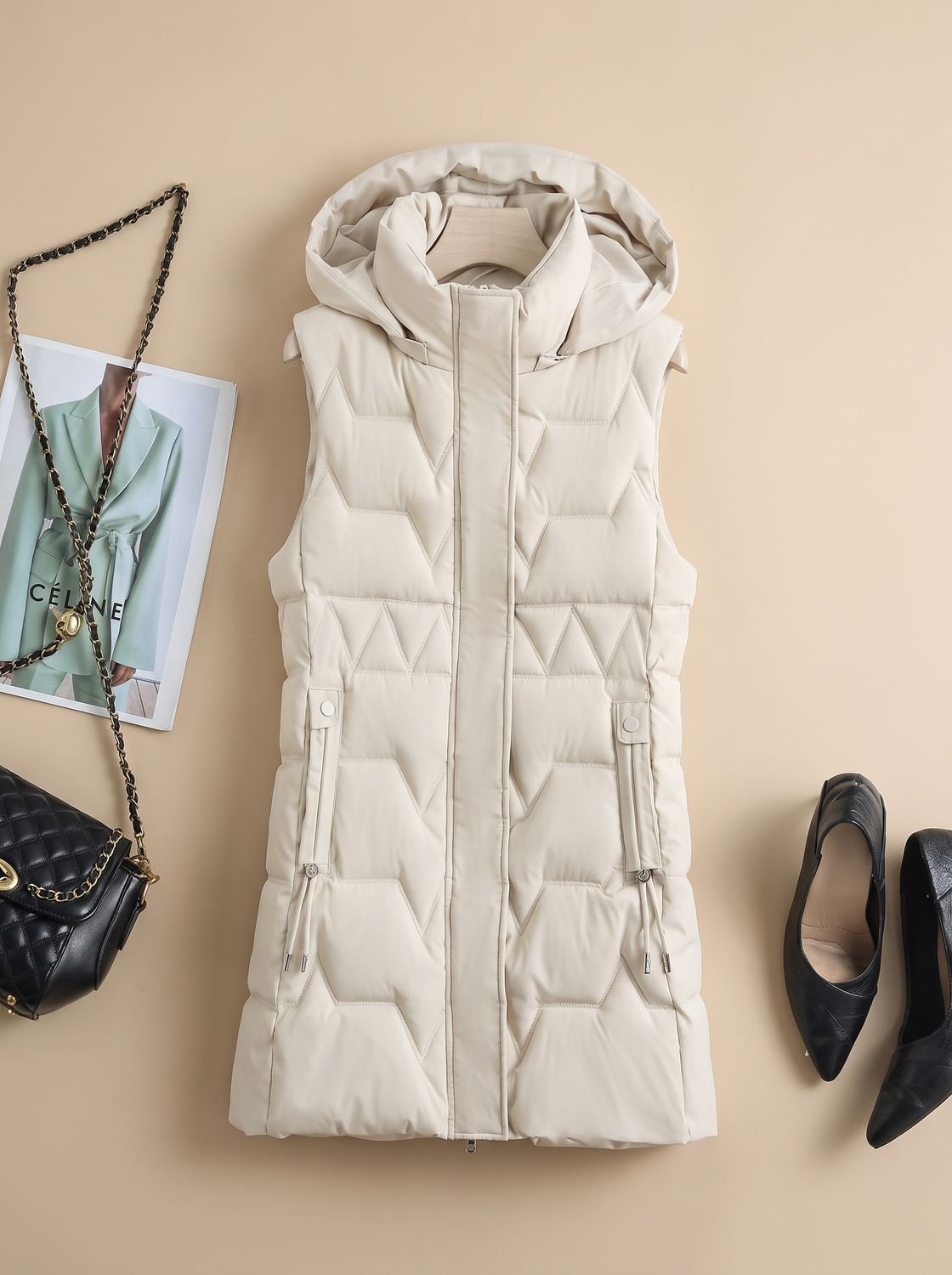 Dames lange gewatteerde bodywarmer met capuchon